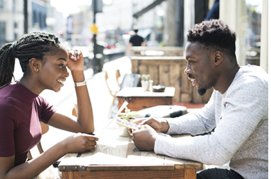 Couple reading the menu at a cafe